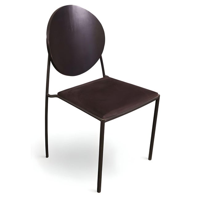 Pair of Memphis-style "Vik-Ter" black side chairs by Dakota Jackson. The chairs feature a curved circular backrest on a...