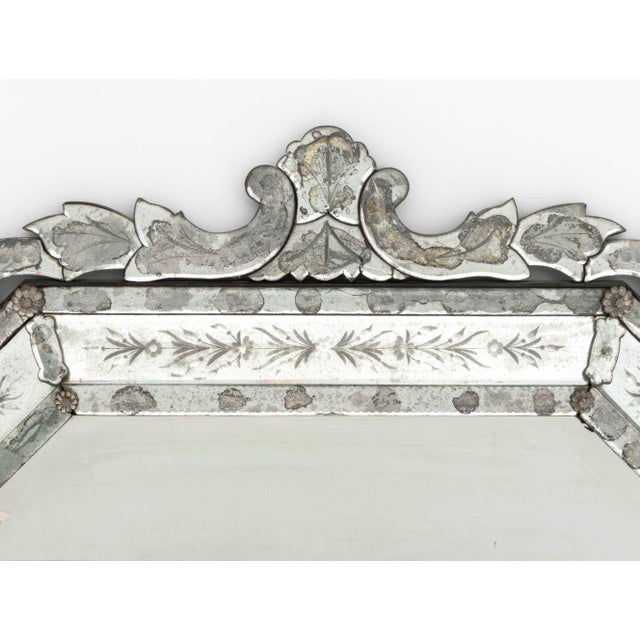 Venetian Glass Overmantel Mirror, with etched decoration and beveled glass panels. Overall: 42.5" H x 45.5" W x 2.75" D....