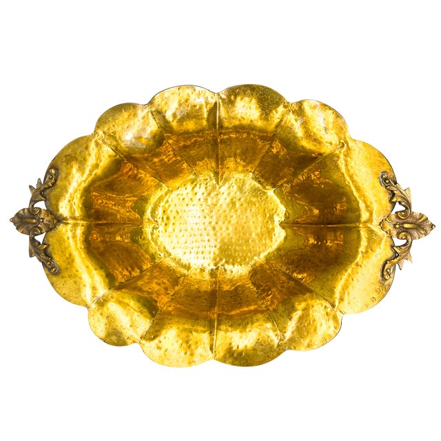 Striking, vintage hand-hammered brass centerpiece bowl featuring a broad scalloped rim, deeply shaped sides, and ornate...