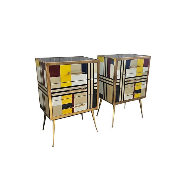 Pair of entirely handcrafted dressers, with a wooden frame covered in colored glass and three drawers; trim, handles, and...