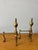This handsome pair of vintage English brass andirons brings timeless formality and quiet grandeur to the hearth. The...