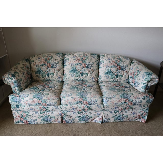 This early 1990s Cream Floral Couch is beautifully patterned with full bodied pink and blue flowers accompanied with...