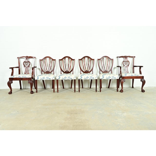 A gorgeous set of four Federal or Hepplewhite style shield back side chairs and a pair of Chippendale style armchairs By...