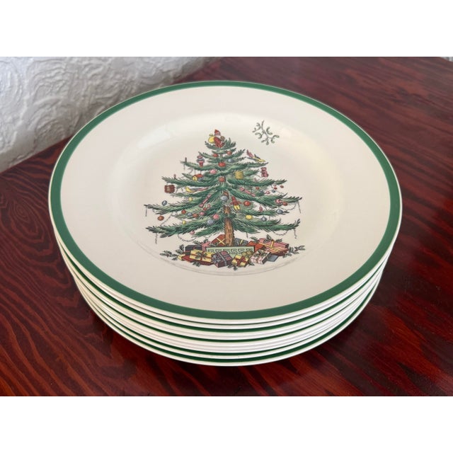 Set of nine Spode Christmas Tree dinner plates with the classic decorated tree with Santa topper. A small sprig of...