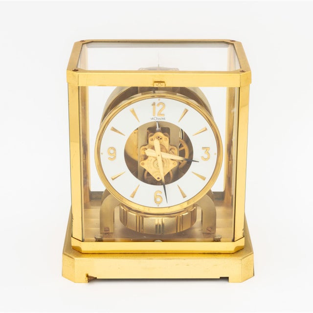 Jaeger-LeCoultre & Cie Atmos Perpetual Motion Brass Mantel Clock, 1960s, with white patinated clock face and brass numbers...