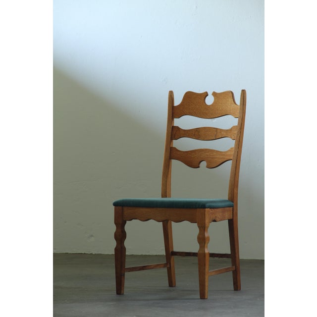 Set of six Danish dining chairs in solid oak, from the Mid-century modern era, designed in the 1960s by Henning Kjærnulf....