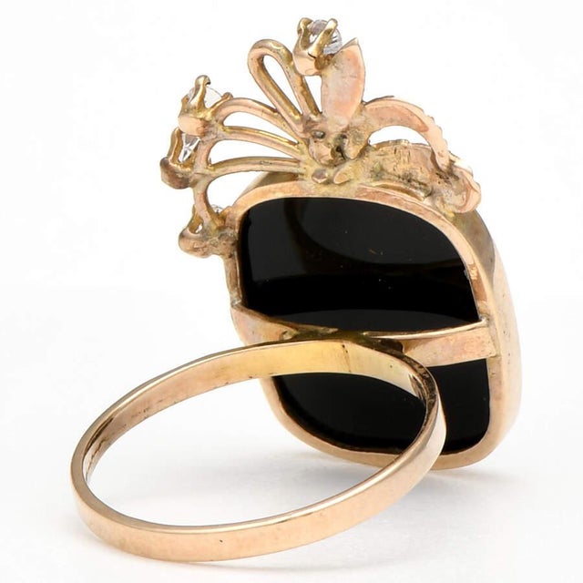 This ring combines the timeless beauty of onyx with the dazzling attraction of cubic zirconia. Resizable to provide the...