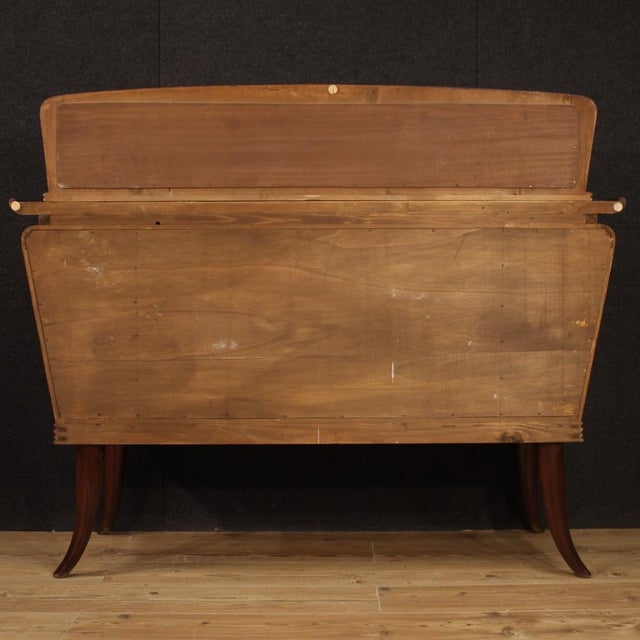 Italian design sideboard from the 50s / 60s. High quality furniture carved and veneered in mahogany, walnut, beech and...
