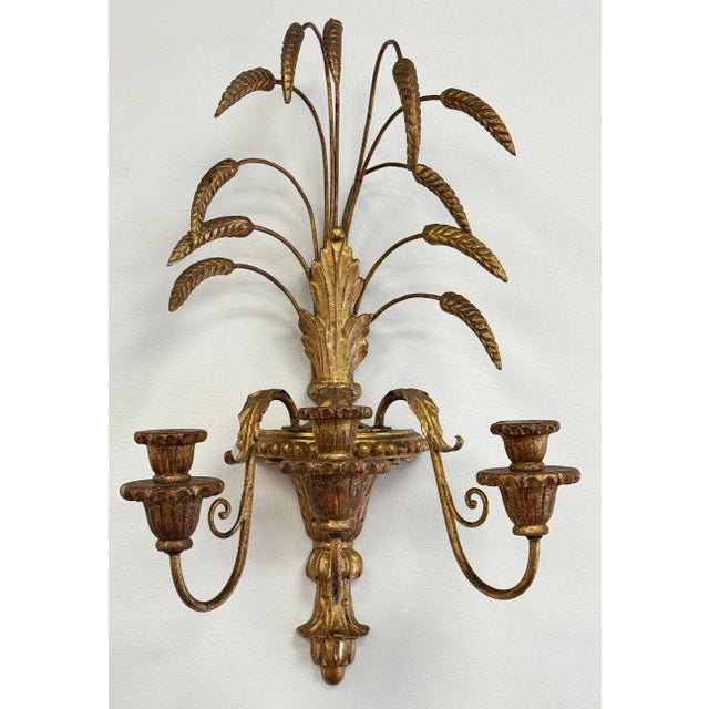 Pair of large Mid-Century era Italian hand-carved gilt wood wheat sheaf candle wall sconces that hold three (3) taper...