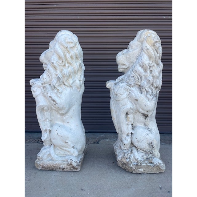 Overview A regal pair of early 1900s cast concrete sentinel lions salvaged from a historic estate garden in Asheville,...