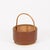 Wonderful and unique large decorative basket in curved rattan and brown leatherette. This stylish organic basket was...