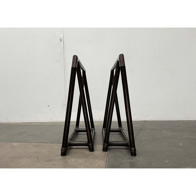 Two impressive trestle legs in dark wood and chrome. The legs feature a sturdy triangular construction. The design is...