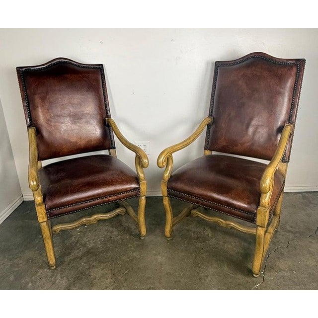 This handsome pair of armchairs dates to the mid-20th century and is most consistent with Italian craftsmanship,...