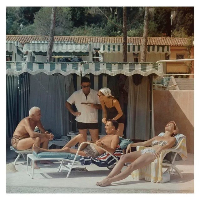 Summer In Monaco 1957 1957: Film director Howard Hawks (1896 – 1977) and his wife Dee spend a summer day by the pool in...