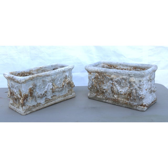Stunning trough concrete rectangular planters with a whitewash chalky finish. These planters feature relief carvings of...