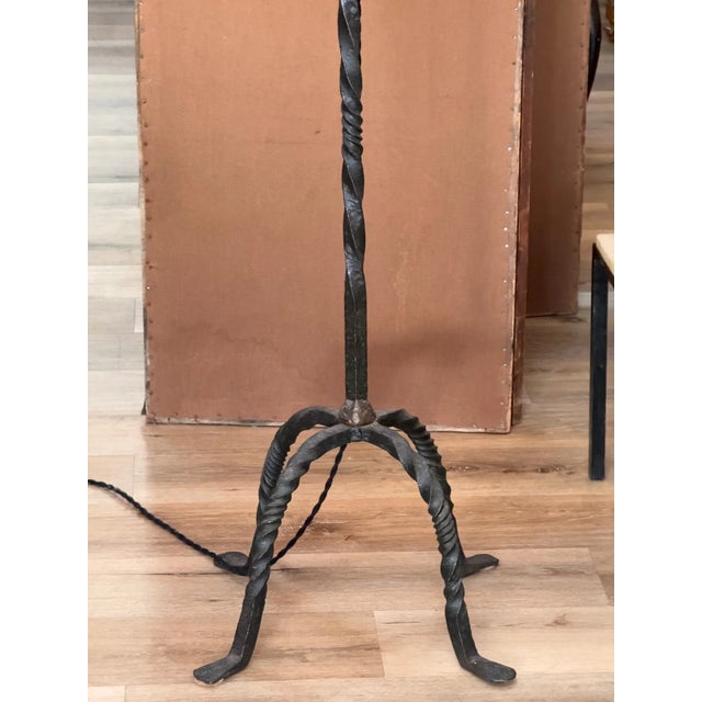 French Iron floor lamp, mid-century. 59” H. to top of iron. 65”h.. to top of fixture. 20” w. x 20” d. Newly Wired.