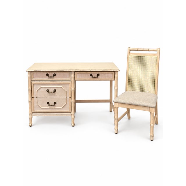 A charming vintage Broyhill writing desk accompanied by its coordinating cane-back chair, dating to approximately the...