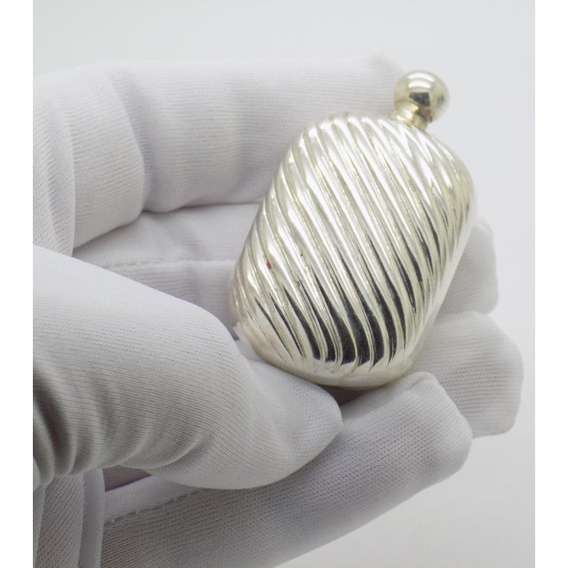 This Italian personal vanity accessory is designed as a miniature, functional perfume flask. Manufactured in Florence...