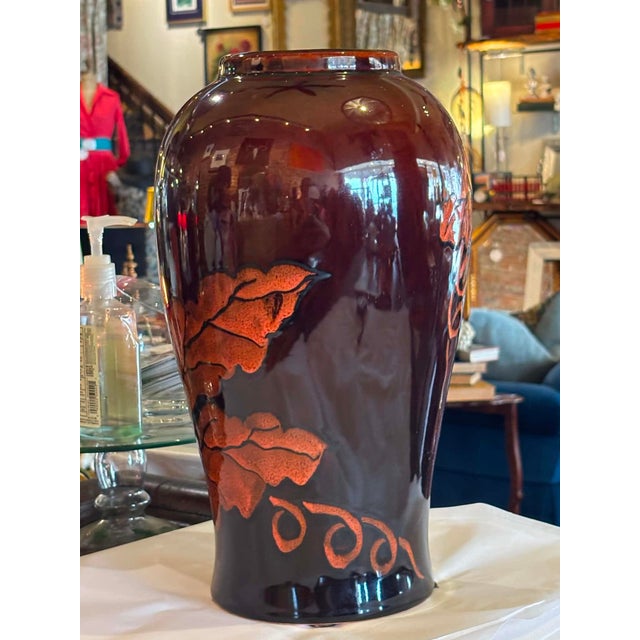 Lovely Brown and orange glazed ceramic vase in a leave and vine motif. Beautiful condition