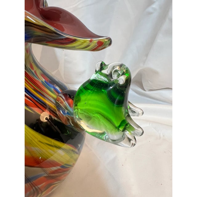 Beautiful unmarked piece of art glass with applied bird. No damage. A beautiful and colorful addition to any display!