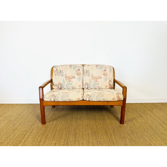 Elegance, simplicity, and craftsmanship define this two-seater sofa by dyrlund, the iconic danish company known for its...