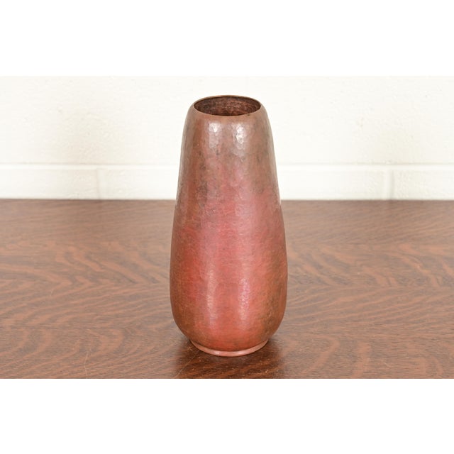 A gorgeous Arts & Crafts hand hammered copper vase In the manner of Roycroft By Ramon Ramirez Mexico, Mid-20th Century...