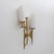 Pair of Brutalist cast bronze wall lamp, made in the Maison Arlus style, in the manner of Felix Agostini. This wall lamp...