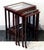 Elegant Art Nouveau side table set comprising four individual tables of varying sizes that slide into one another; each...