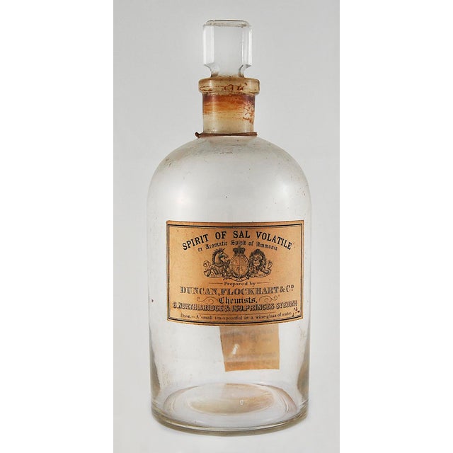 A Pair Vintage English Chemist Bottles, one from A. E. Hobbs Ltd. Chemists in Tunbridge Wells, England, and the other from...