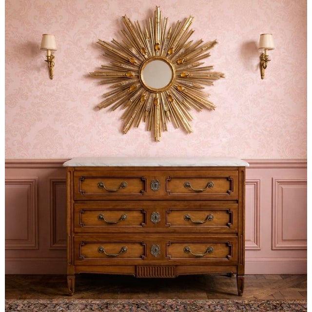 This is a 1960s carved walnut Louis XVI style marble top commode by Henredon. The drawers are dovetailed, and one has the...