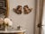 Pair of antique hand carved Italian angels or putti with softly painted faces and gilded accents. Executed in the...
