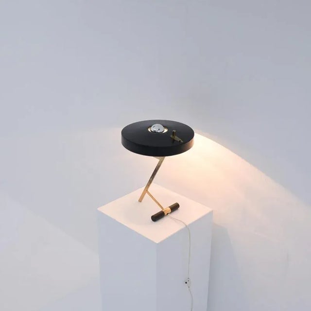 This iconic desk lamp was designed by Louis Christiaan Kalff for Philips Eindhoven in 1955. It has a black shade and a...