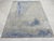 An 8' x 10' hand-knotted wool rug with a silver gray field washed with steel blue in a loose, painterly abstract. Newly...
