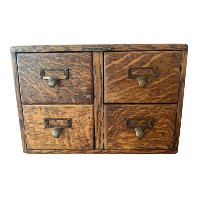 An authentic early 20th-century Library Bureau four-drawer oak card catalog, crafted in richly figured quarter-sawn oak...