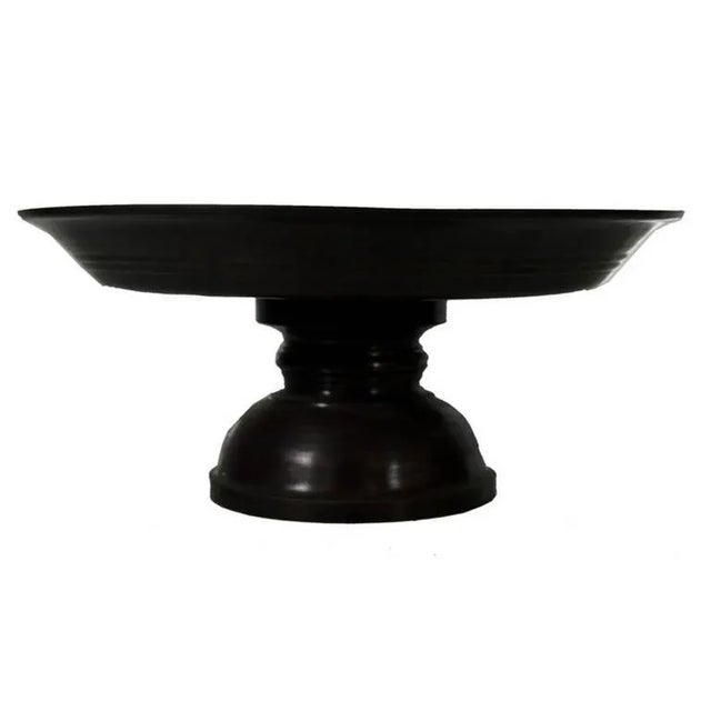 A Thai cake stand made of bronze in a refined cylindrical shape from the late 20th century. This cake stand displays a...
