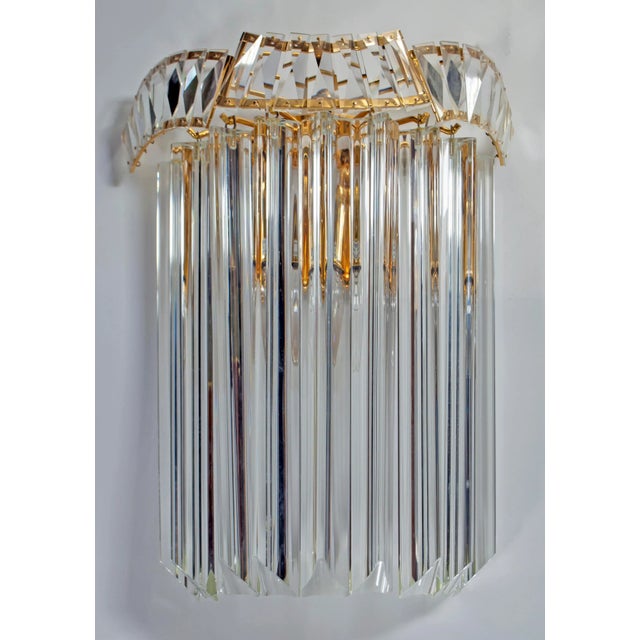 This pair of Murano glass sconces consists of 9 glass pieces each. The lams have a gilded brass structure. They were...