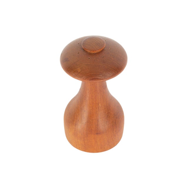 A teak pepper mill and salt shaker designed by Danish designer Jens Harald Quistgaard (1919-2008) for Dansk. Made in...
