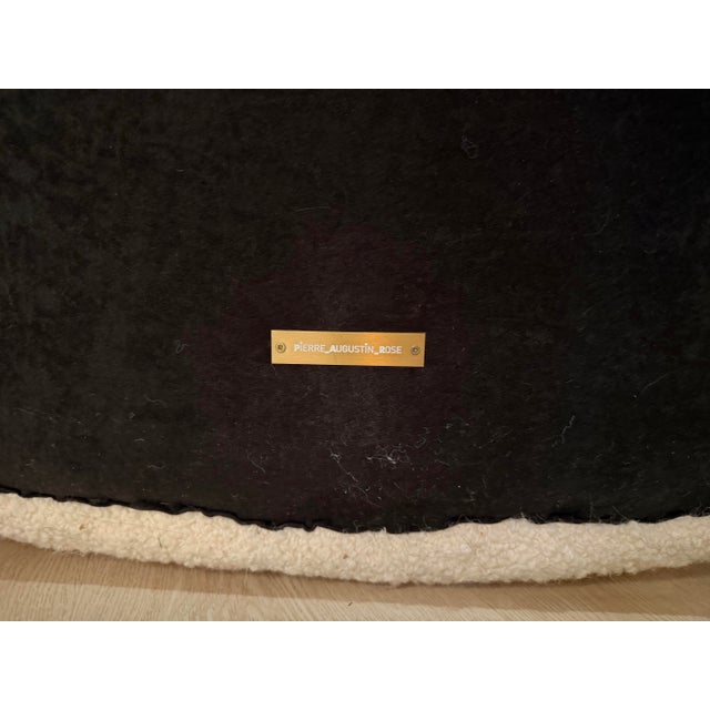 Exceptional Pierre Augustin Rose curved sofa, upholstered in a soft boucle-textured fabric with the brand’s signature...
