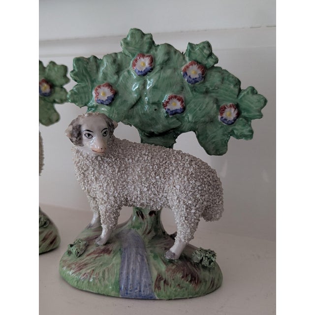 A 19th century antique English Staffordshire pastoral figurine set of two. Ewe with confetti bocage. 4" w x 3" d x 5" h...