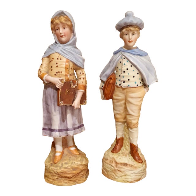 Pair of Early 20th Century German Bisque Figurines of Schoolchildren For Sale