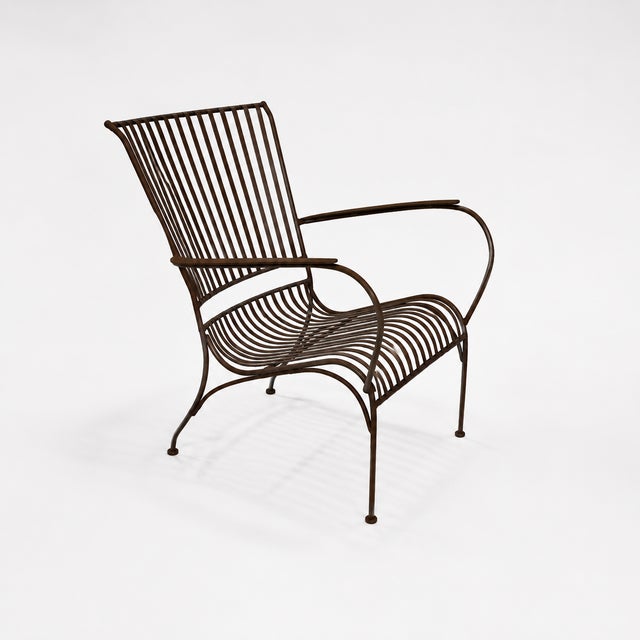 Sold as a set of 4. These vintage iron outdoor lounge chairs feature a sculptural mid-century modern design defined by...