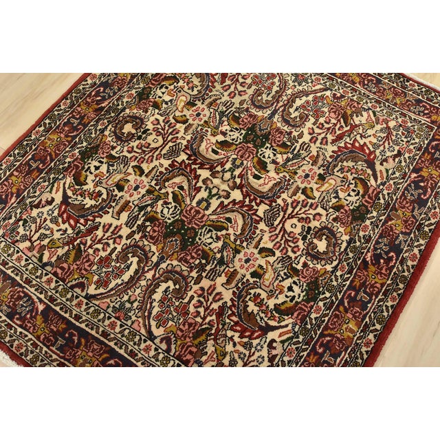 An authentic vintage traditional Bidjar rug hand-knotted with fine wool and natural dyes. This intricately woven rug...