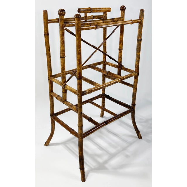 Antique bamboo magazine or album rack featuring a rich burnt tortoise finish. Long legs give this piece a substantial and...
