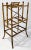 Antique bamboo magazine or album rack featuring a rich burnt tortoise finish. Long legs give this piece a substantial and...