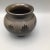 Squat vase with embossed leaf and geometric design , signed on the bottom and reads Hand Made for Anette Williams in...