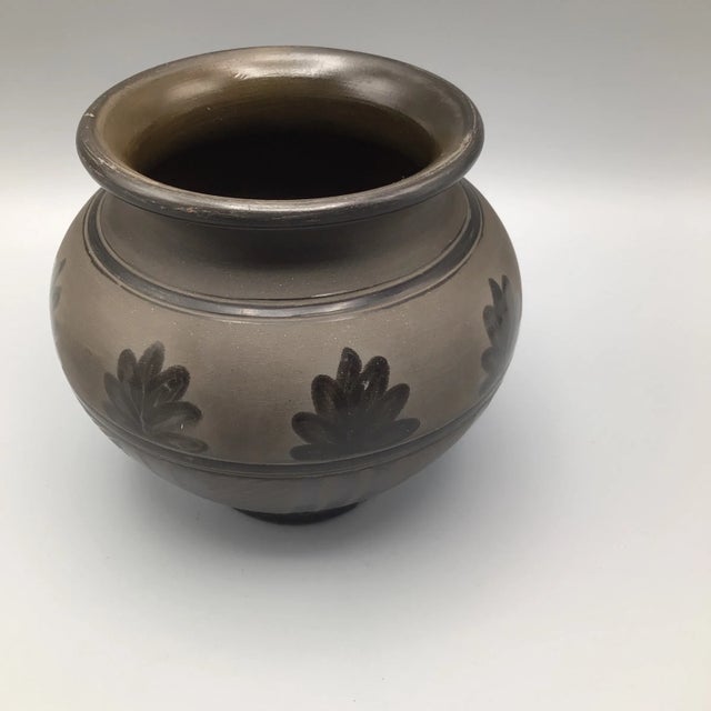 Squat vase with embossed leaf and geometric design , signed on the bottom and reads Hand Made for Anette Williams in...