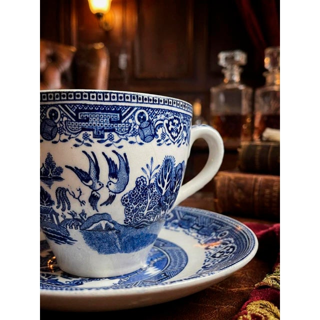 This elegant vintage Blue Willow teacup and saucer set is a beautiful example of traditional English transferware,...