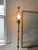 Metal floor lamp with bronze stars and moon or etoile and lune motif. Slender lamp with alternating design jutting...