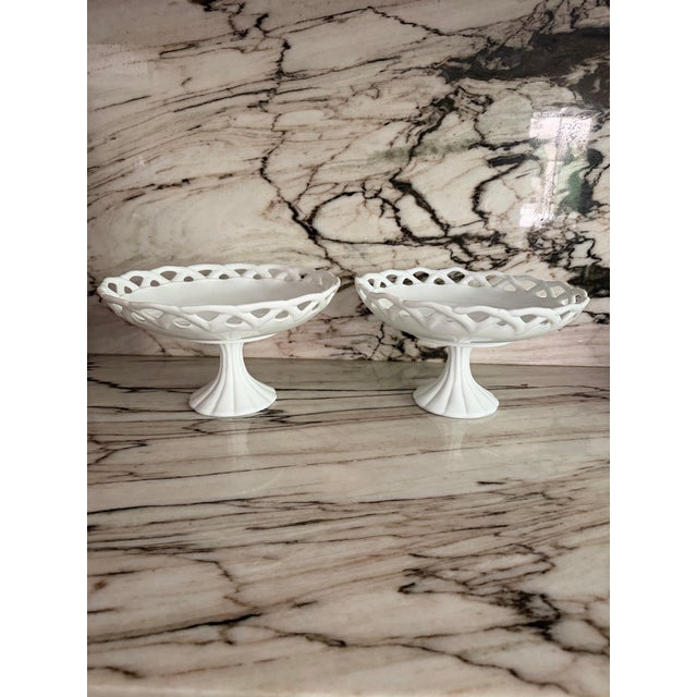 Gorgeous pair of vintage white milk glass pedestal footed fruit bowl or compote with an open lace, scalloped rim, made by...