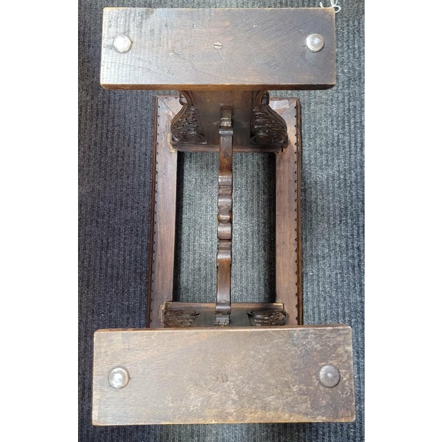 Stunning circa 1900 Italianate Renaissance and Baroque revival hand-carved walnut table with a black marble top. The table...